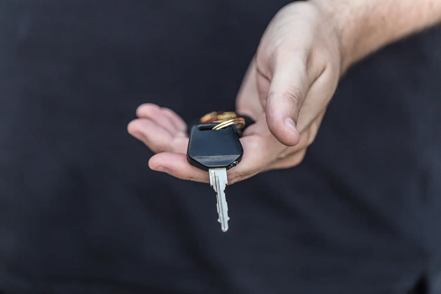 Person holding car keys